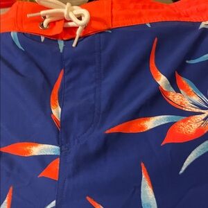Travis Mathew Blue and Orange Floral Swim Trunks